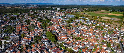Aerial panorama view around the city Nauheim in Germany on a sunny day in summer.