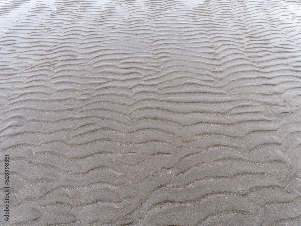 Relief on a sandy beach, full frame. Wavy pattern. Relief on a sandy beach, full frame. Wavy pattern.