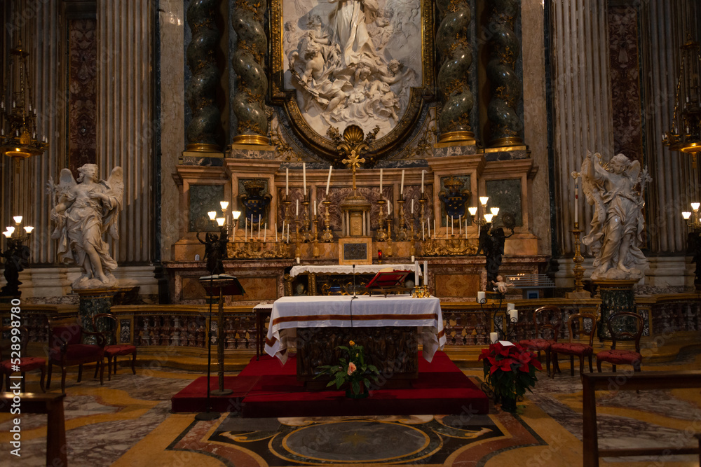 Naklejka premium basilica of the jesuits and tomb of saint ignacius in rome street in ruins of the roman empire in rome, italy with ancient stones and texture