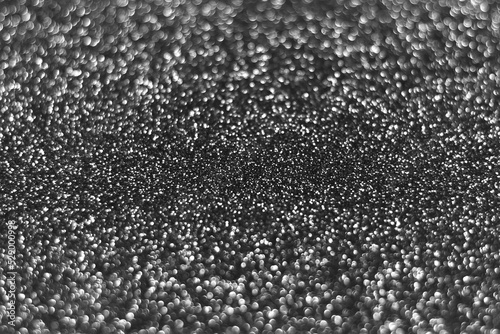 Gray silver sparkling glitter bokeh background, christmas abstract defocused texture. Holiday lights. Snowy shiny sparkle stars for celebrate