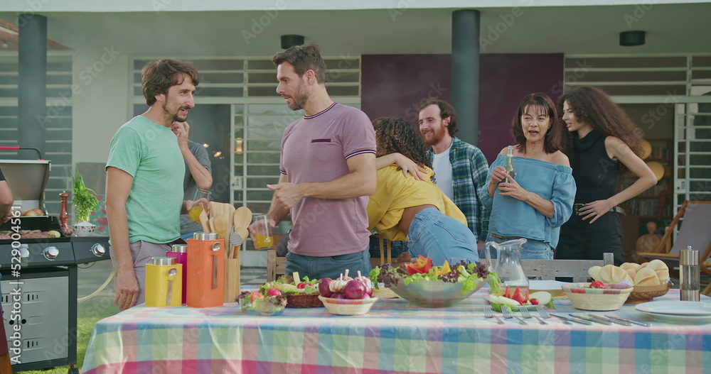 custom made wallpaper toronto digitalGroup of friends chatting at barbecue in home backyard. Man handing beer to friend. People greeting each other in celebration