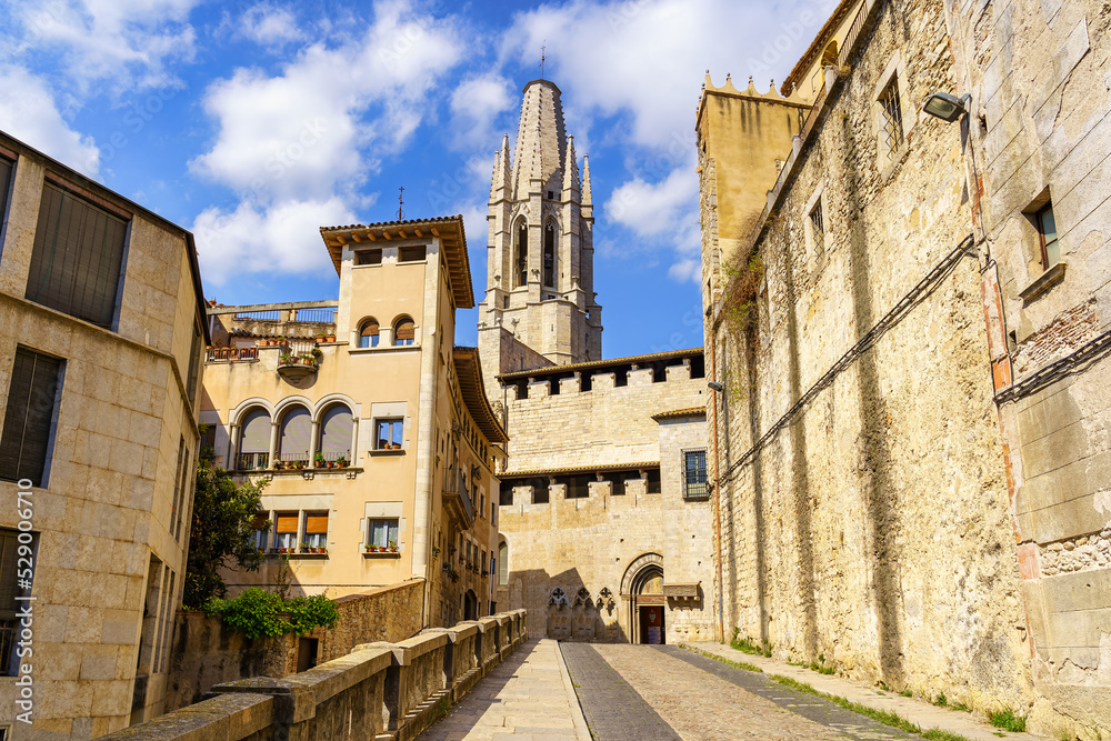 Access street to the cathedral of Girona with old and stately buildings next to the church, Girona, Catalonia.