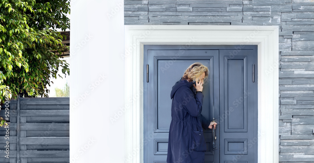 young man opening the door of his house.Inviting the guests young man opening the door of his house.Inviting the guests