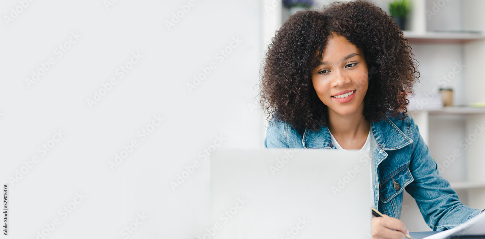 American woman sits in the white office of a startup company, she is a company employee, young generation operations run the company with the concept of the new generation. Company management concept American woman sits in the white office of a startup company, she is a company employee, young generation operations run the company with the concept of the new generation. Company management concept