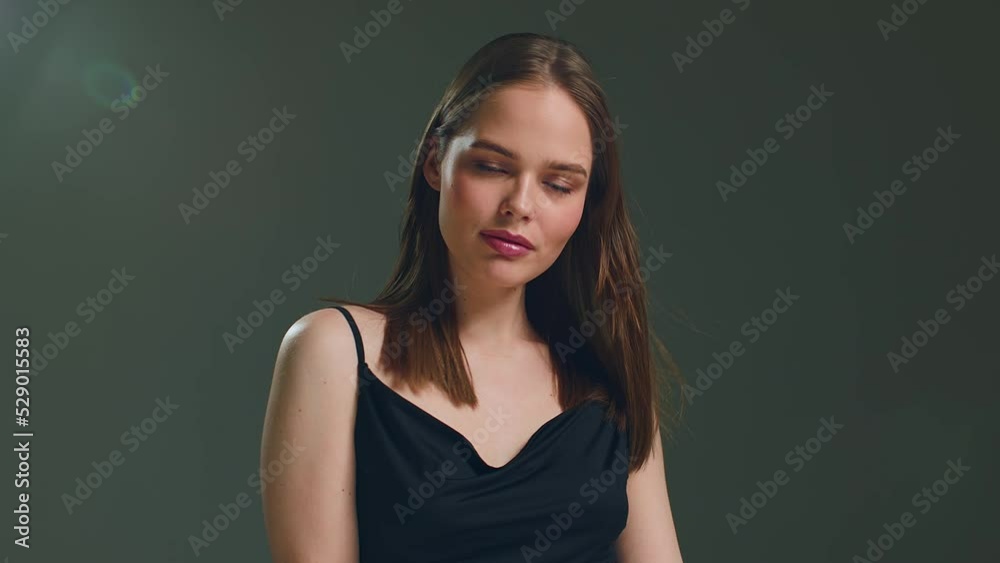 Stylish lovely caucasian young girl fashion model with perfect smooth face skin posing in studio. ProRes, handheld video Stylish lovely caucasian young girl fashion model with perfect smooth face skin posing in studio. ProRes, handheld video