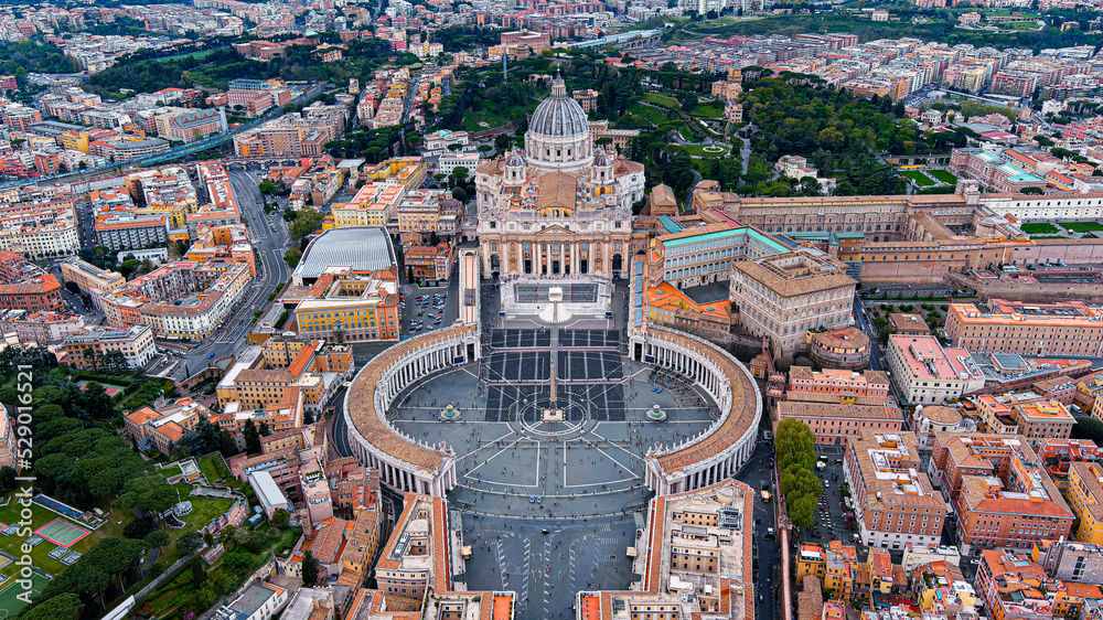 Aerial view of St. Peter's Basilica in Vatican City within the city of Rome, Italy. Papal Basilica of Saint Peter is Renaissance style church and tourist attraction seen from above drone flying in 6K