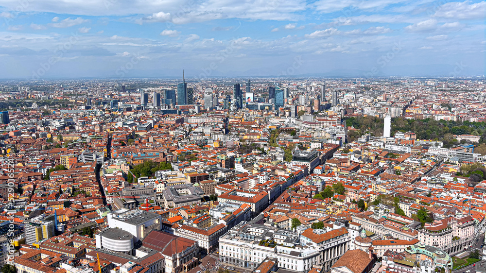 Aerial view of new Milan skyline, Italy. Panorama of Milano city with Porta Nuova futuristic business district. From above drone view of suburb downtown and cityscape with the tall modern buildings 6K