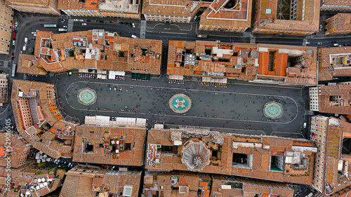 Fototapeta Naklejka Na Ścianę i Meble -  Aerial Stock Footage of a Bird's Eye View Flying Over Piazza Navona and city streets at day in Rome, Italy