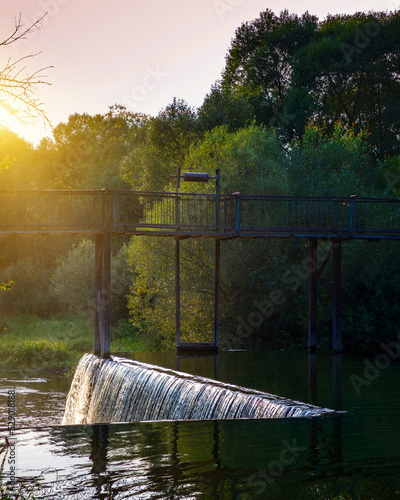 A beautiful artificial waterfall for swimming in the summer in the city of Satanov. photo