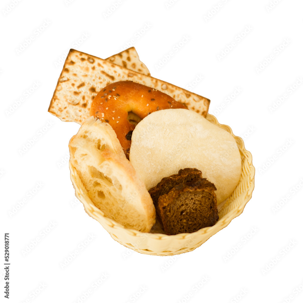 Jewish matzah bread and flatbread and rye bread and bagels with sesame seeds and wheat bread. Slices of different bread in a basket on a transparent background. Isolated image. Jewish matzah bread and flatbread and rye bread and bagels with sesame seeds and wheat bread. Slices of different bread in a basket on a transparent background. Isolated image.