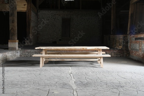Wooden rustic table with benches. Fototapet