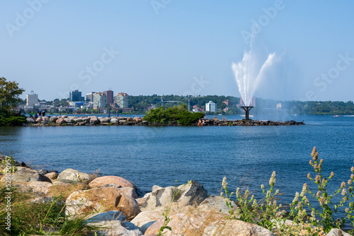 Centennial Park Waterfront Fountain on Shore of Kempenfelt Bay, Lake Simcoe in summer time, Barrie, Ontario, Canada. photo