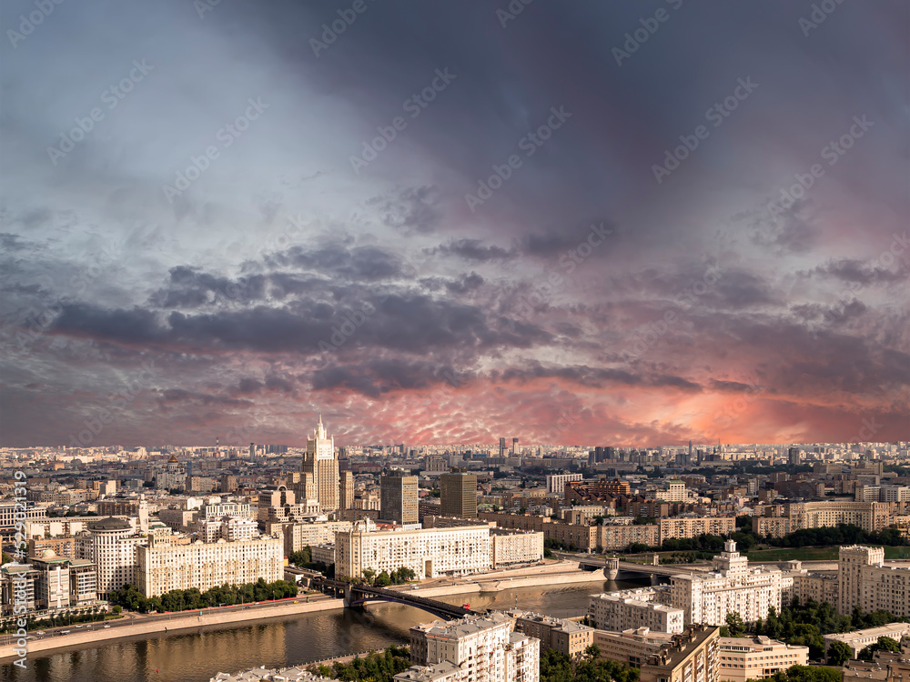 Aerial view of center of Moscow against the background of a romantic evening sky with clouds and rays of the sun (building Ministry of Foreign Affairs), Russia