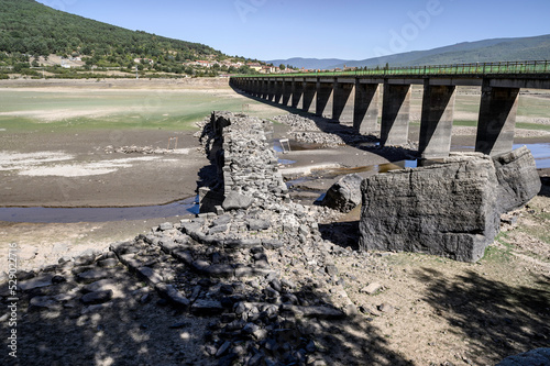 Close-up of the ruins of the Roman bridge of Vinuesa, Soria Spain. This bridge is most of the year sunk in the waters of the Cuerda del Pozo reservoir, Soria, Spain, discovered by the drought photo