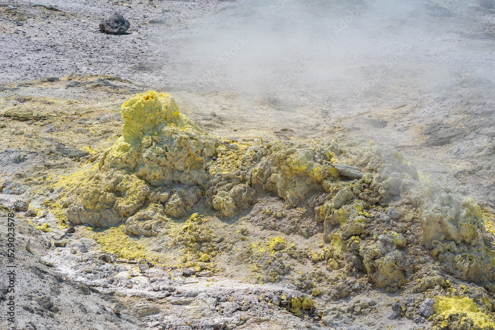 smoking solfatara in a fumarole field on the slope of the Mendeleev volcano smoking solfatara in a fumarole field on the slope of the Mendeleev volcano