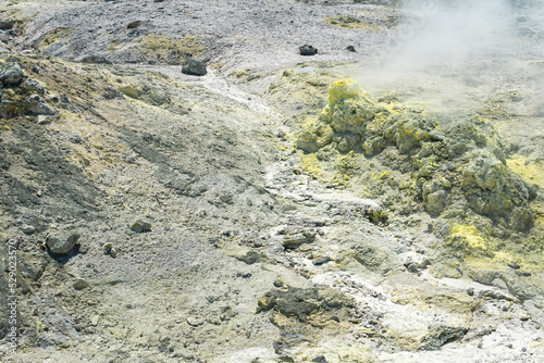 tephra soil with yellow deposits of sulfur minerals in the area of volcanic gases in the solfataric field