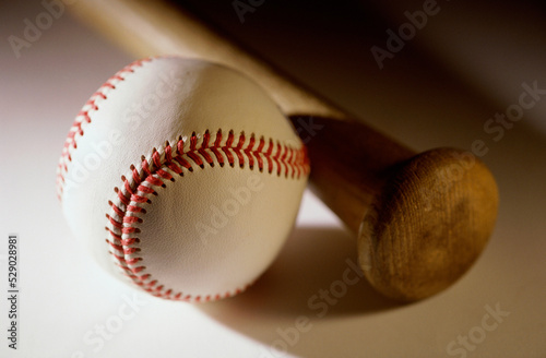 Close-up of a baseball bat and a baseball