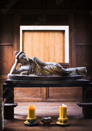 A reclining Buddha greets guests in the reception lobby of a resort in Thailand. Koh Samui, Thailand