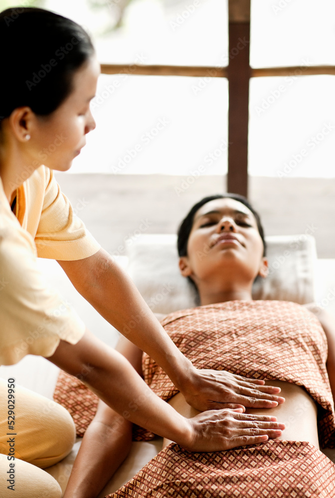 Woman Receiving Chi Nei Tsang, Taoist Abdominal Massage. Koh Samui, Thailand. Woman Receiving Chi Nei Tsang, Taoist Abdominal Massage. Koh Samui, Thailand.