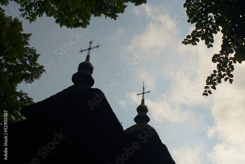 silhouette of domes of a wooden church