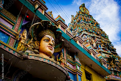 Closeup of the Beautiful Face of the South Indian Hindu Goddess of Rain, Mariamman, with Ganesh on Her Right, on the Exterior of the Sree Dandu Mariamman Temple in Bengaluru, India