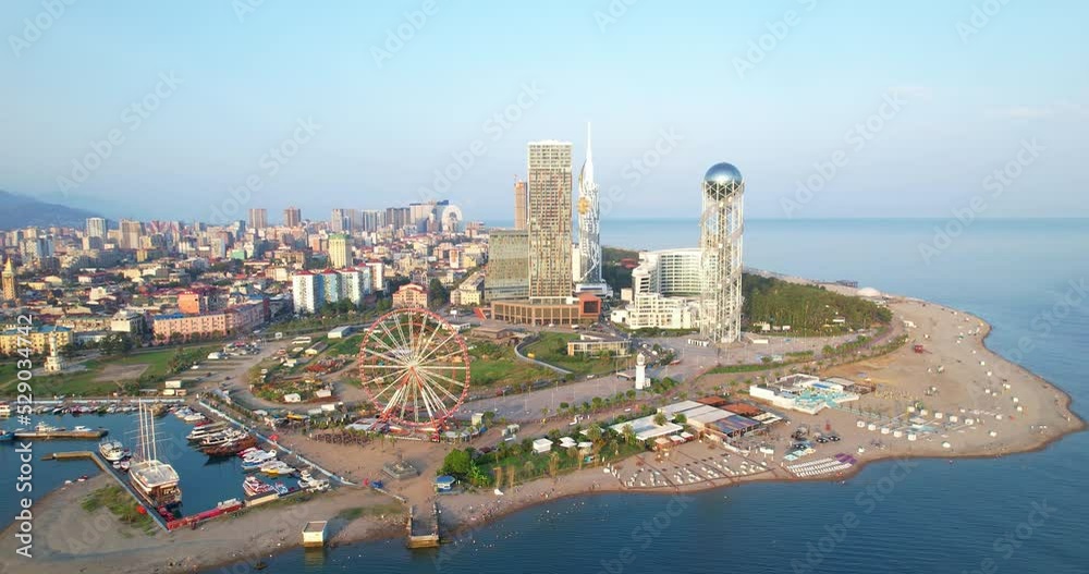 Aerial view of the city of Batumi, Georgia. The city is located on the seashore. Batumi embankment at dawn. Aerial view of the city of Batumi, Georgia. The city is located on the seashore. Batumi embankment at dawn.