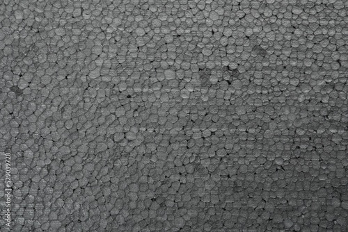 Texture of grey styrofoam sheet as background, closeup