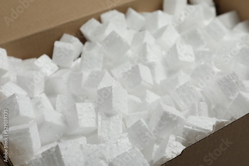 Closeup view of cardboard box with styrofoam cubes