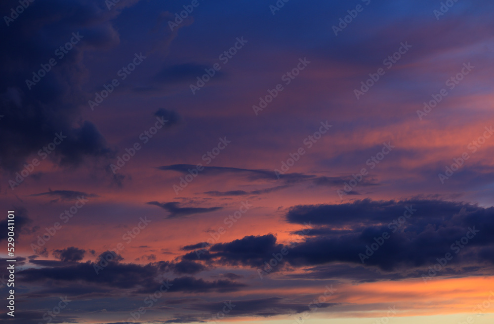 Dark and colorful sunset background on a summer evening.