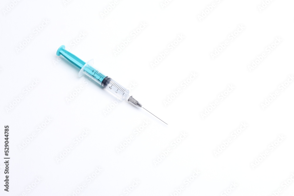 Medical syringe on a white background. A syringe for injection. The concept of health and beauty Medical syringe on a white background. A syringe for injection. The concept of health and beauty
