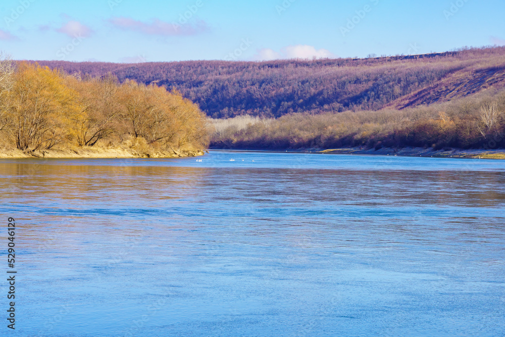 Beautiful view of the river bank calm winter wildlife. Background with copy space