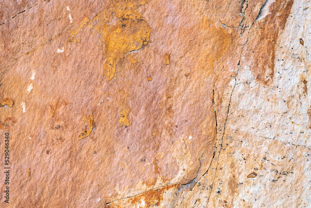 Background texture of sandstone stone surface, rough chopped orange stone for background