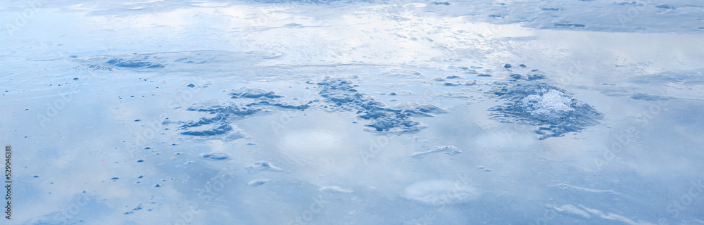 Christmas blue background with a frozen pattern. Empty space for text, wet ice Christmas blue background with a frozen pattern. Empty space for text, wet ice