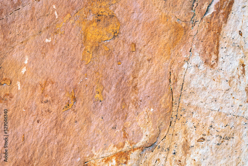 Background texture of sandstone stone surface, rough chopped orange stone for background