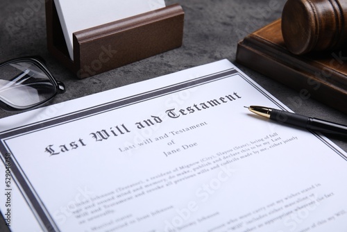 Last will and testament with pen on grey table, closeup