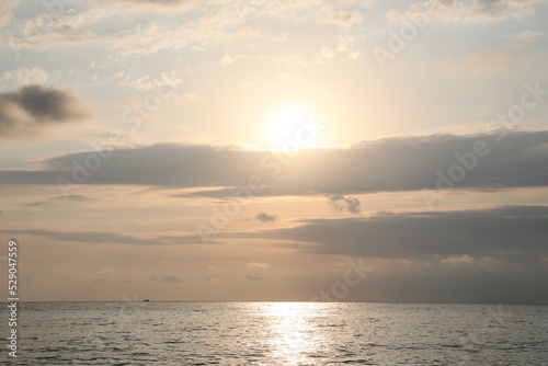 Picturesque view of sunset with beautiful clouds over sea