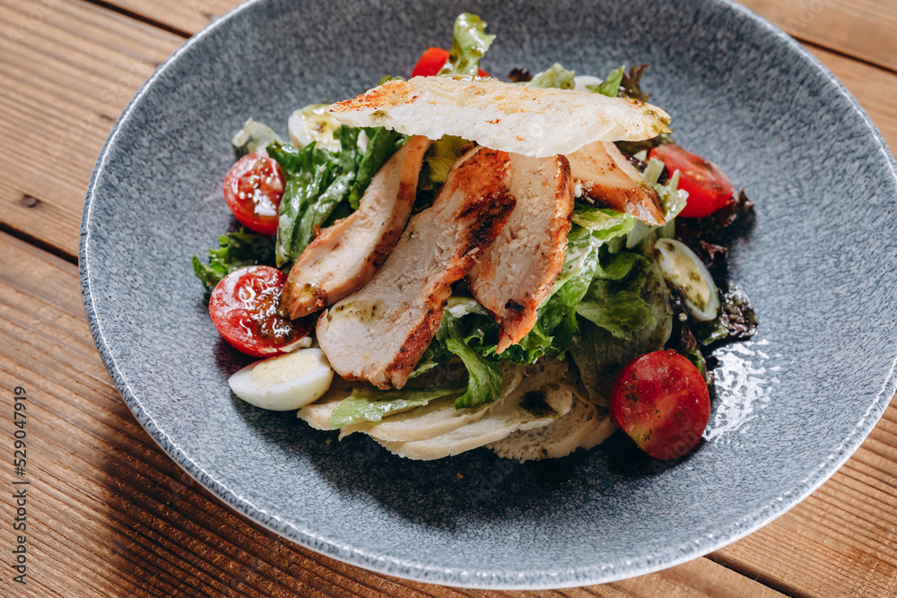 A interesting meat salad is served to the costumers in the traditional restaurant. A interesting meat salad is served to the costumers in the traditional restaurant.