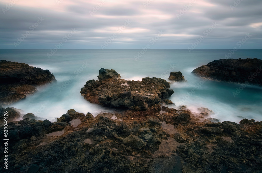 Dramatic volcanic rocky coastal seascape scenery at Charco del Palo, Lanzerote, Canary Islands, Spain 