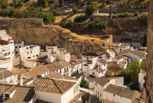 Beautiful panoramic view of Setenil de las Bodegas white houses on a sunny day. Cadiz, spain