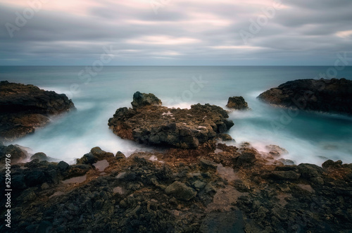Dramatic volcanic rocky coastal seascape scenery at Charco del Palo, Lanzerote, Canary Islands, Spain 