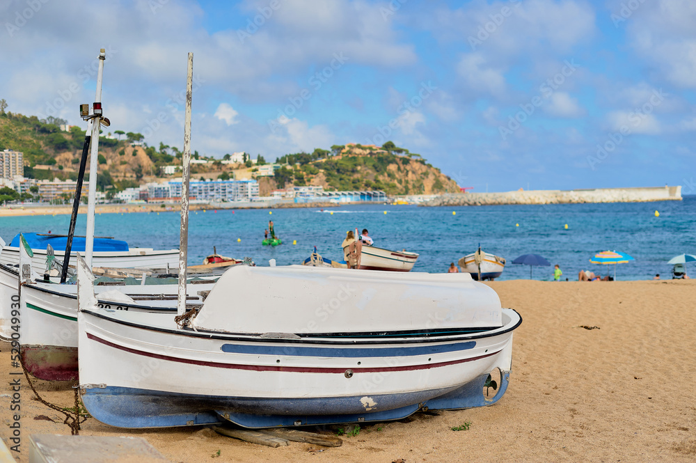 View of Blanes beach with boats in the foreground