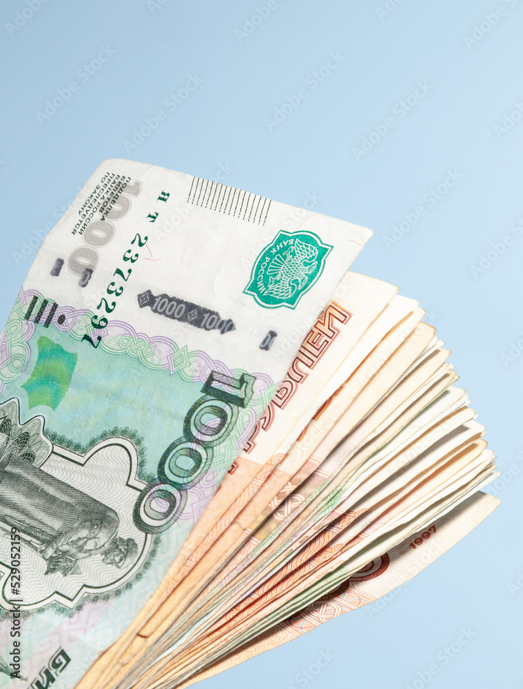 Φωτογραφία paper money spread out in a fan in denominations of one thousand and five thousa