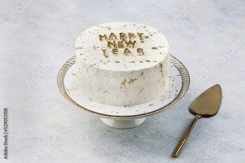 Christmas cake on white cake stand. Copy space.