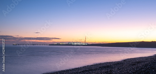 Sunrise over the Bristol Channel and the cranes of Hinkley Point