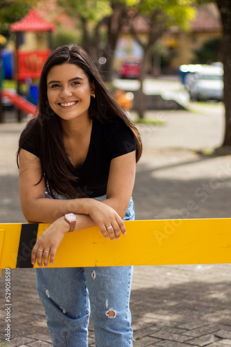 Smiling young girl posing in a park