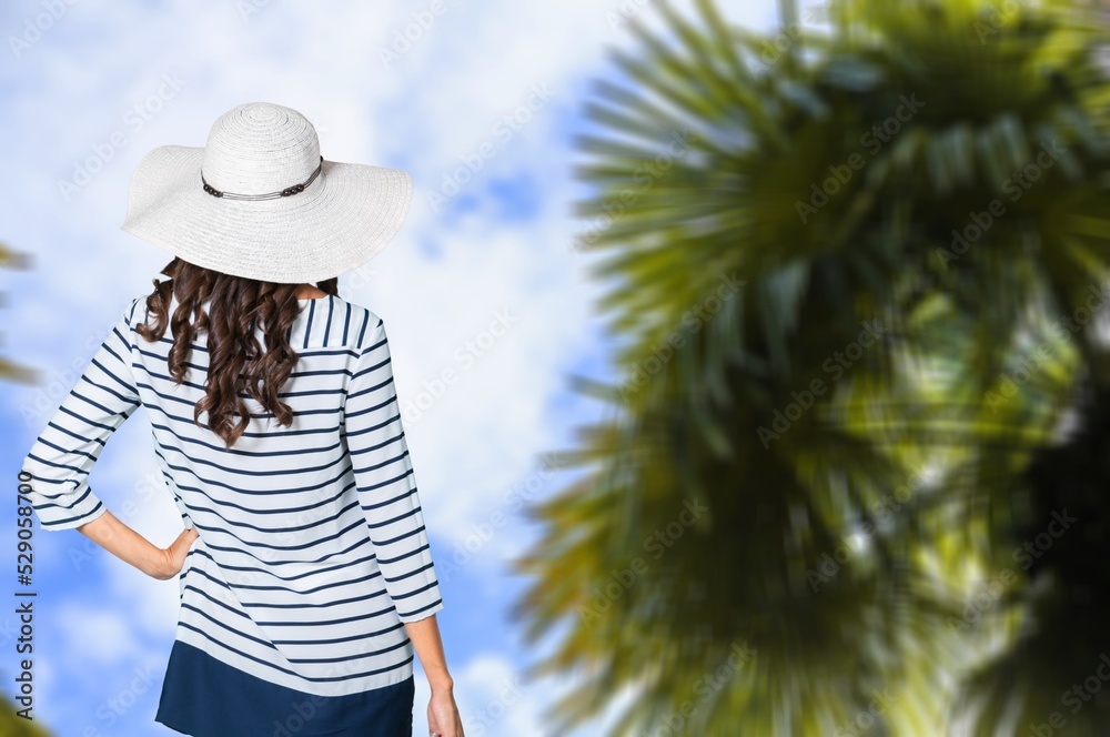 Fototapeta premium Young happy woman enjoying the resort