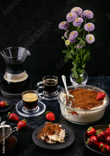 homemade tiramisu and coffee on the table photo