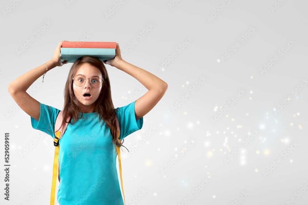 Cute adorable toddler smiling happy stand holding book over head Cute adorable toddler smiling happy stand holding book over head