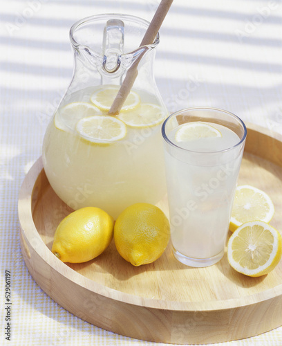 Glass and jug of lemonade