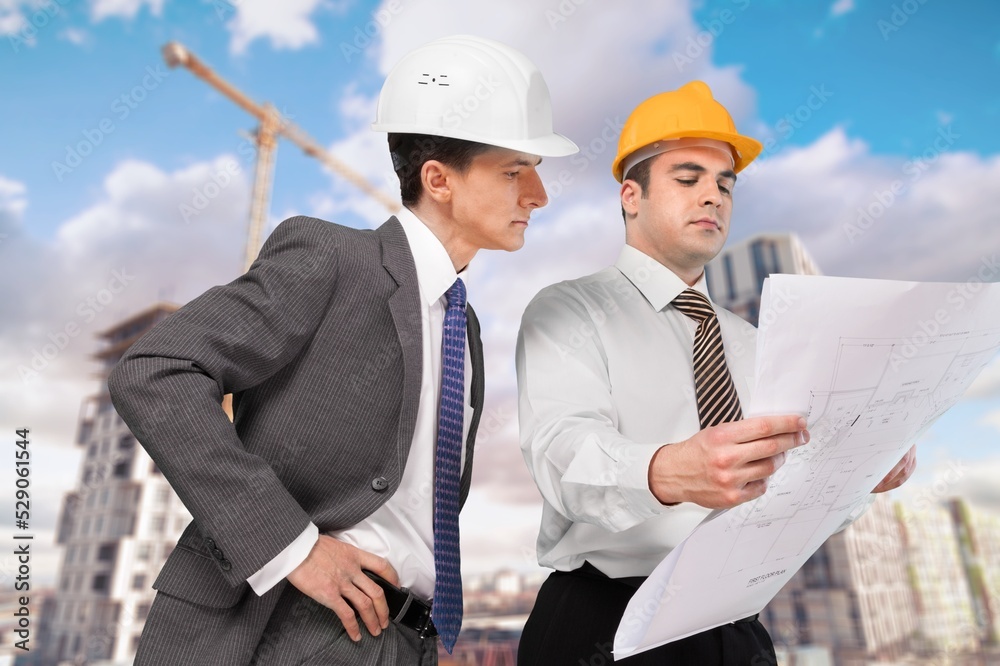 Engineer planning new residential subdivision home building in construction site. Engineer planning new residential subdivision home building in construction site.